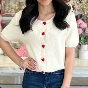 Cream Cardigan with Red Heart Buttons